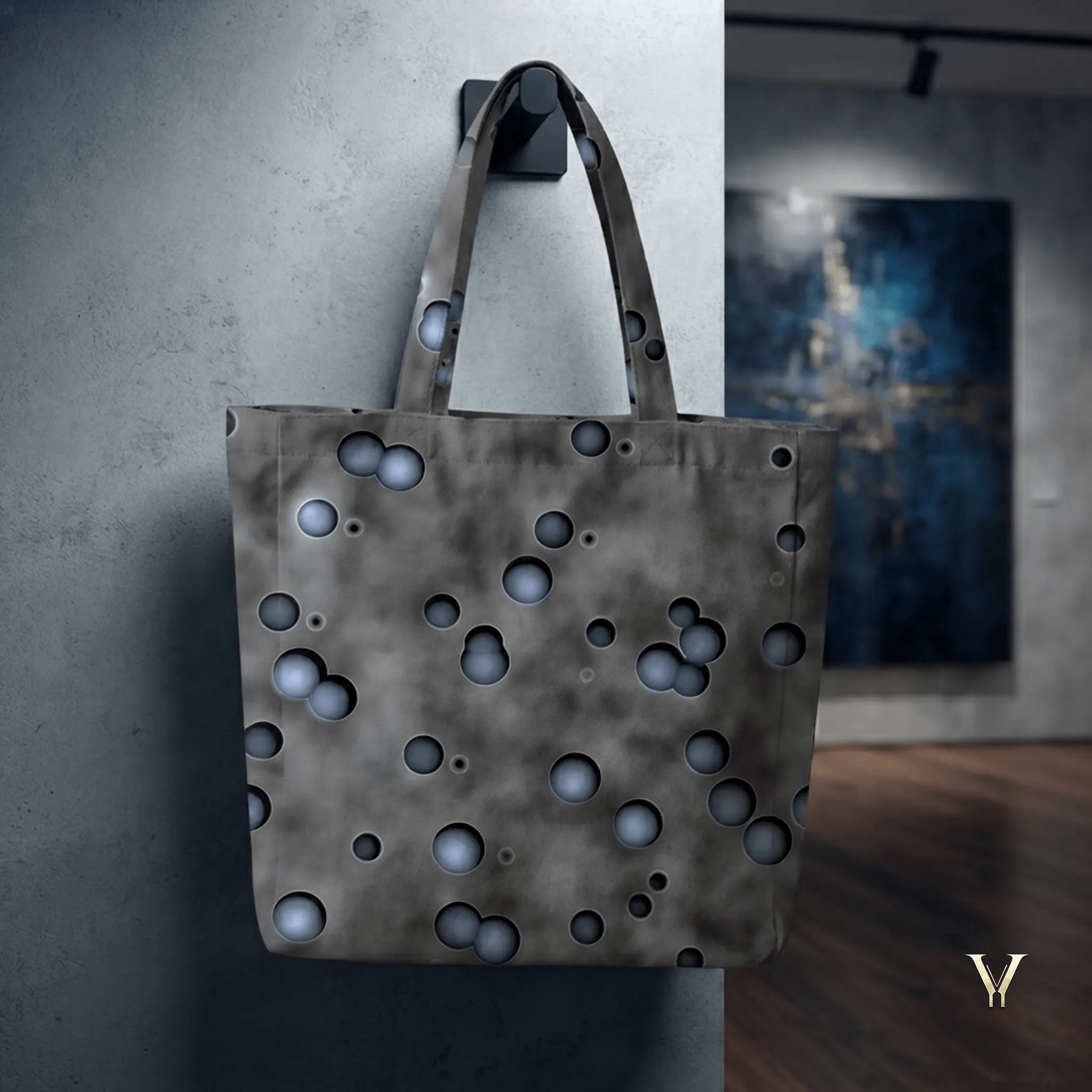 Premium Nebula Droplets AOP Designer Large Tote Bag by VertexVault Studio hanging on a textured concrete wall, showcasing a dark smoky grey cosmic print shoulder bag with 3D blue-grey droplets in a modern studio setting.
